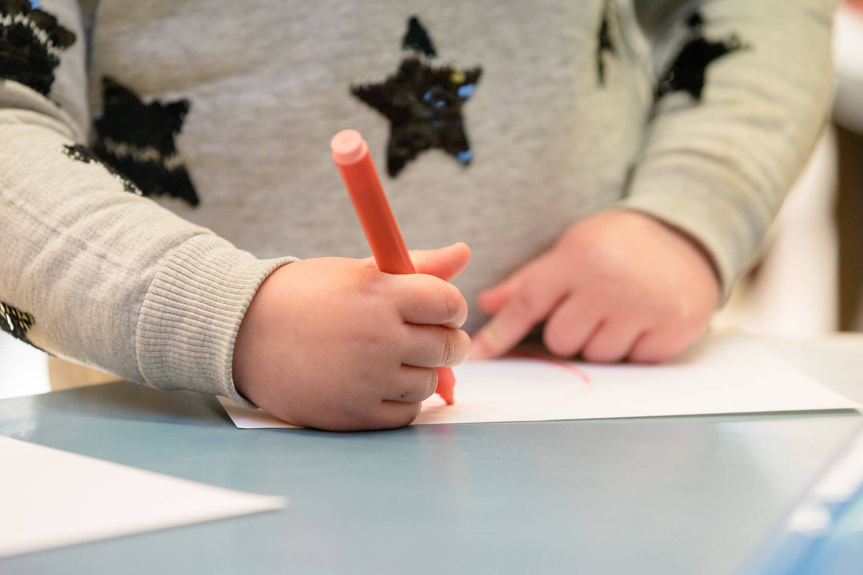 Marshfield Pre-School child taking part in drawing